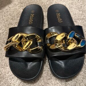 Mudd slides. Black with gold chain detail. Size 9